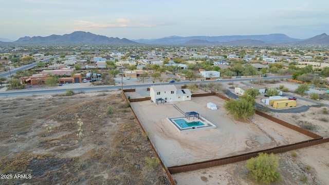 birds eye view of property with a mountain view