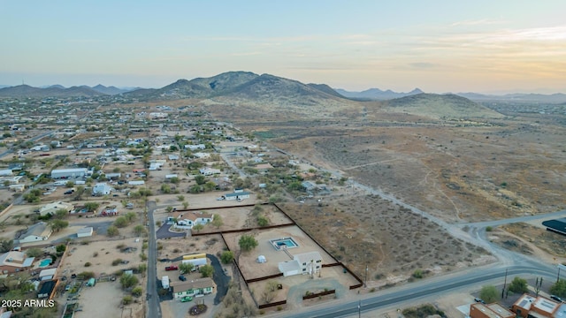 birds eye view of property with a mountain view