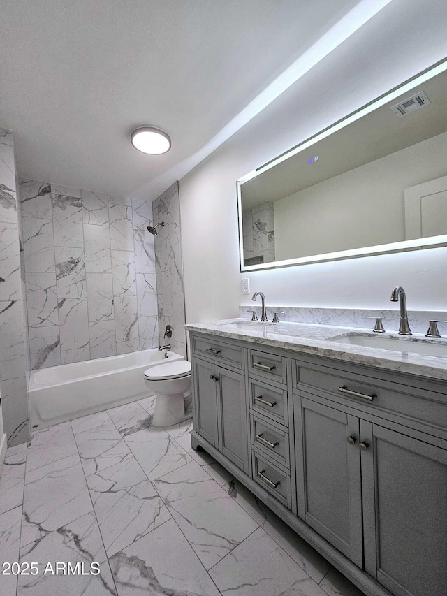 bathroom with marble finish floor, visible vents, a sink, and shower / bathtub combination