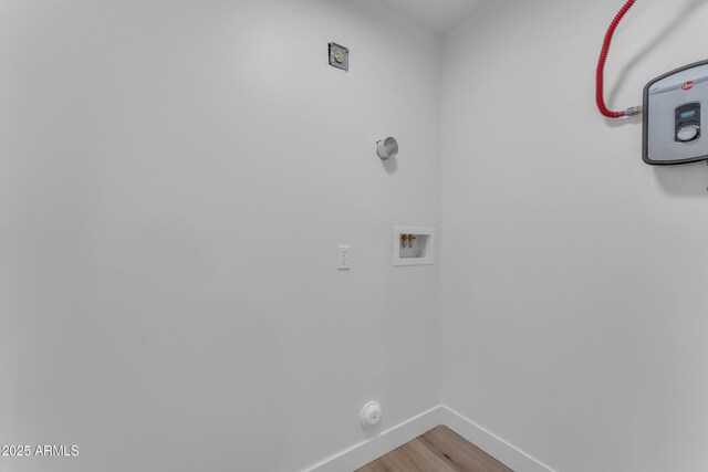2425 E Harvard St, Phoenix, AZ 85008 - clothes washing area with washer hookup, baseboards, light wood-type flooring, and laundry area
