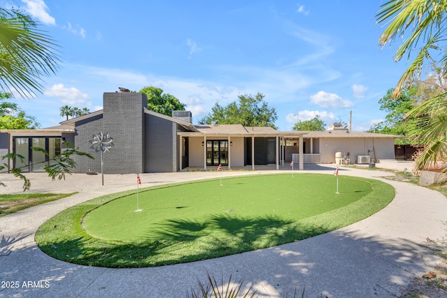 2425 E Harvard St, Phoenix, AZ 85008 - exterior space featuring a chimney, brick siding, and a patio