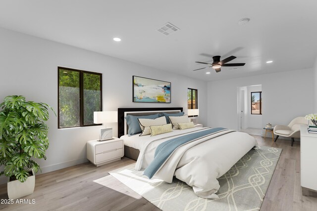 2425 E Harvard St, Phoenix, AZ 85008 - bedroom with recessed lighting, visible vents, light wood finished floors, and multiple windows