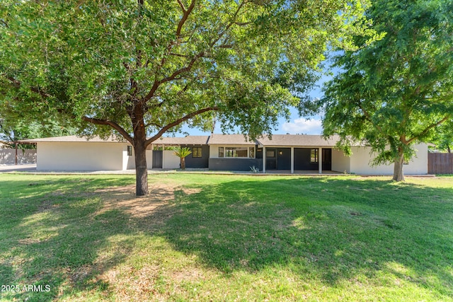 2425 E Harvard St, Phoenix, AZ 85008 - view of front of property with stucco siding, a front lawn, and fence