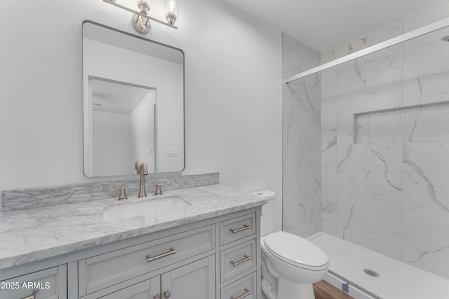 2425 E Harvard St, Phoenix, AZ 85008 - full bathroom featuring toilet, vanity, and a marble finish shower