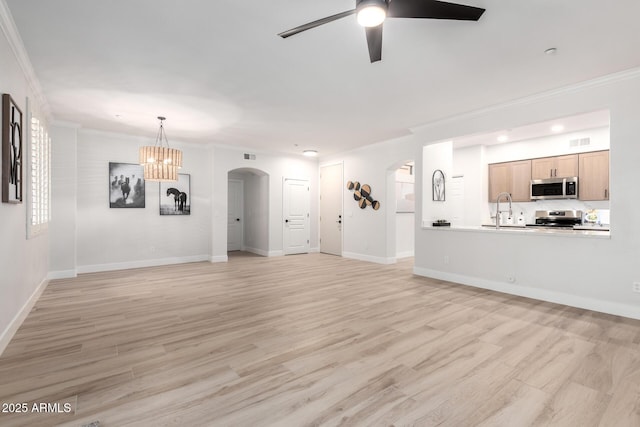 955 E Knox Rd Unit 126, Chandler, AZ 85225 - unfurnished living room with arched walkways, a ceiling fan, crown molding, a chandelier, and light wood-style flooring