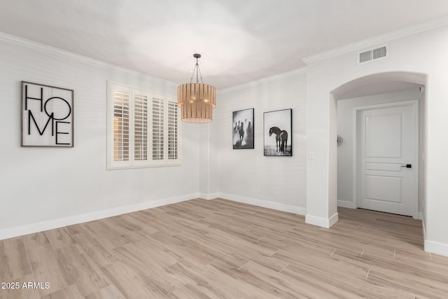 955 E Knox Rd Unit 126, Chandler, AZ 85225 - unfurnished dining area featuring a chandelier, arched walkways, light wood-style floors, and crown molding