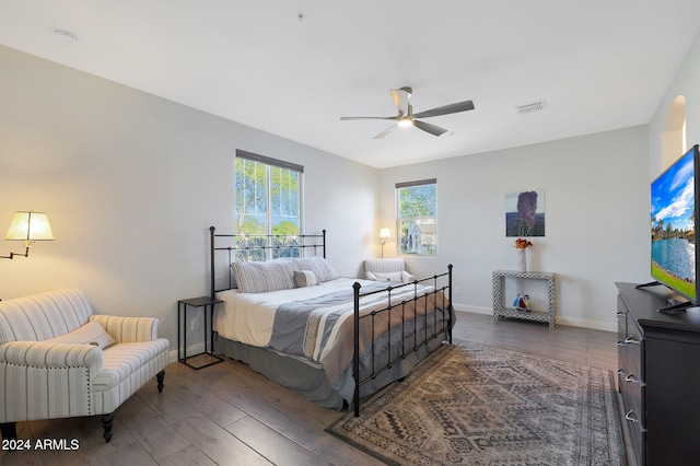 bedroom featuring dark wood-type flooring and ceiling fan