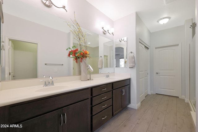 bathroom featuring vanity and hardwood / wood-style flooring