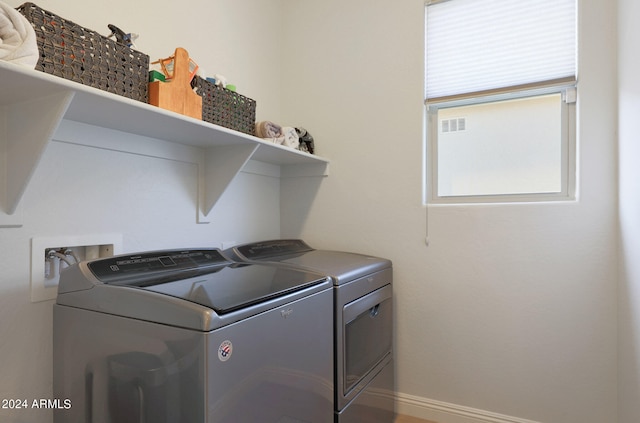 washroom featuring washing machine and dryer