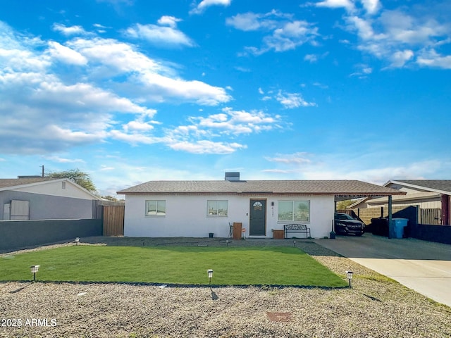 single story home featuring a front lawn and a carport