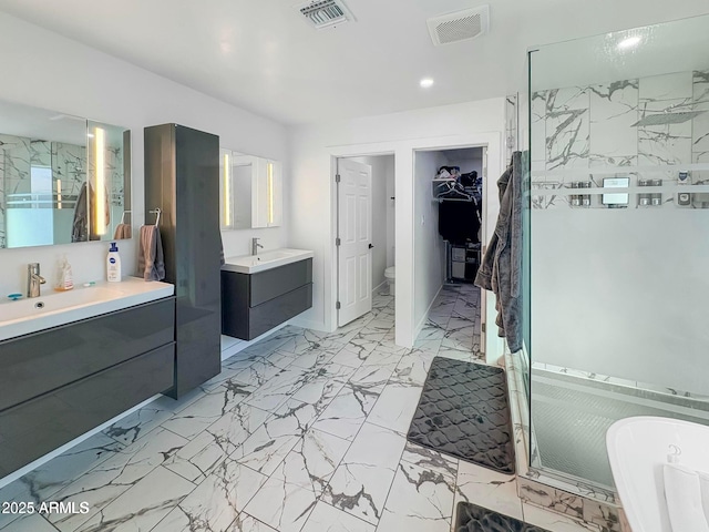 bathroom featuring vanity and shower with separate bathtub