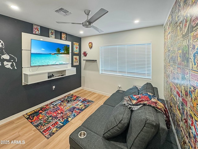 recreation room with hardwood / wood-style floors and ceiling fan