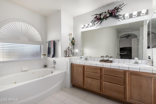 bathroom with vanity, tile patterned floors, and a bathing tub