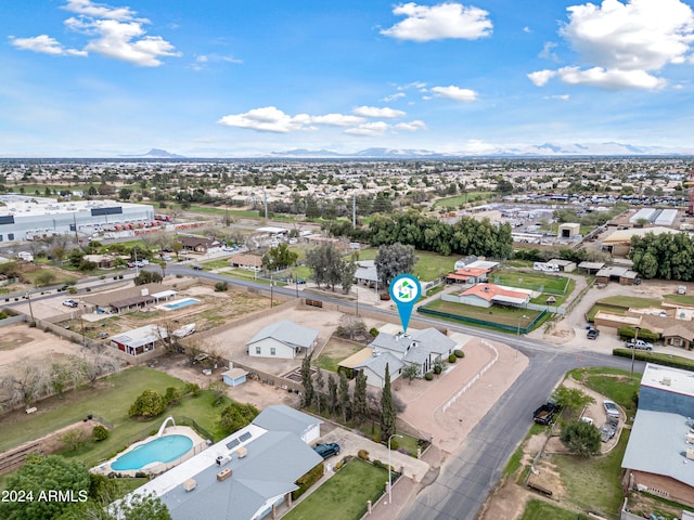 birds eye view of property with a mountain view