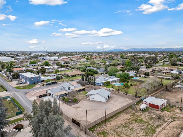 birds eye view of property featuring a mountain view