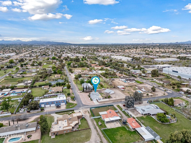 birds eye view of property featuring a mountain view