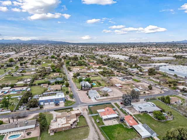 birds eye view of property featuring a mountain view