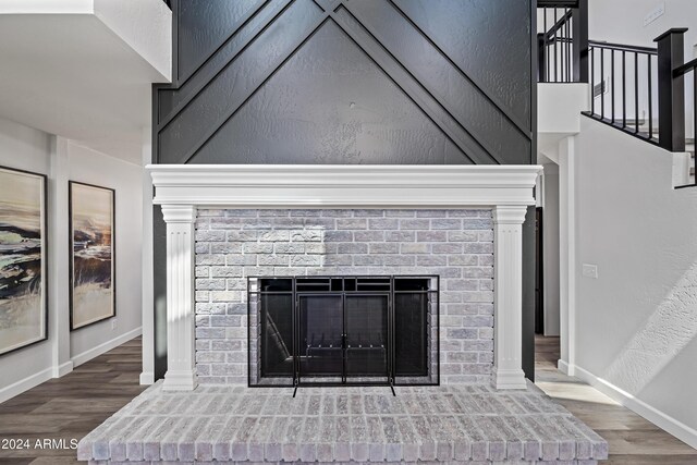 394 E Redfield Rd, Chandler, AZ 85225 - detailed view of wood finished floors, a fireplace, and baseboards