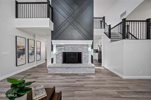 394 E Redfield Rd, Chandler, AZ 85225 - living area featuring a towering ceiling, baseboards, wood finished floors, and stairway