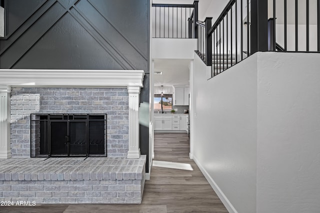 unfurnished living room with a fireplace and hardwood / wood-style floors