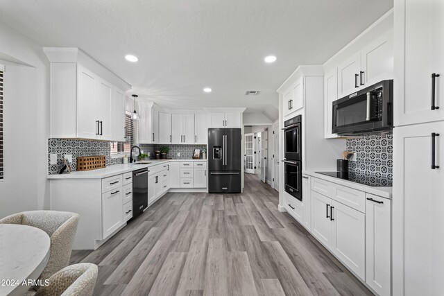 394 E Redfield Rd, Chandler, AZ 85225 - kitchen with black appliances, backsplash, light wood-type flooring, recessed lighting, and white cabinets