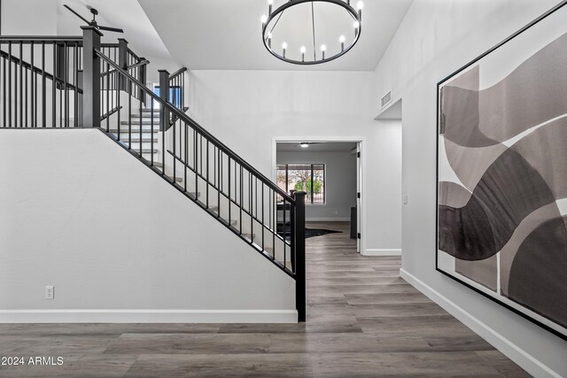 394 E Redfield Rd, Chandler, AZ 85225 - foyer with a chandelier, baseboards, wood finished floors, and stairs