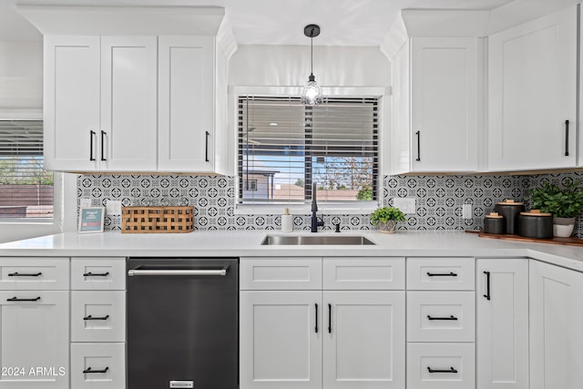 kitchen featuring dishwasher, white cabinets, plenty of natural light, and sink