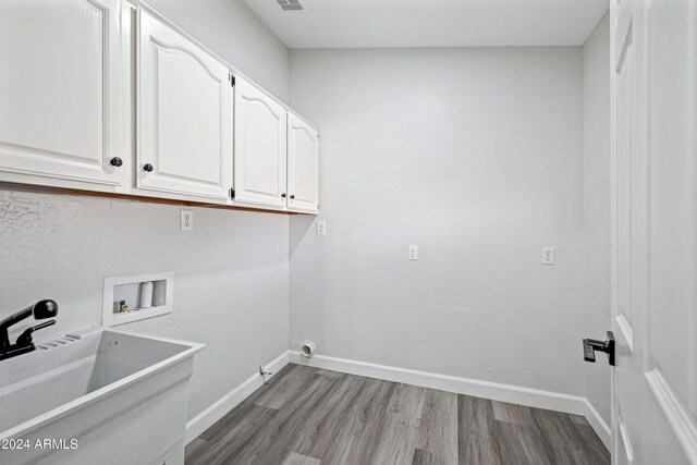 394 E Redfield Rd, Chandler, AZ 85225 - laundry room featuring cabinet space, wood finished floors, baseboards, and hookup for a washing machine