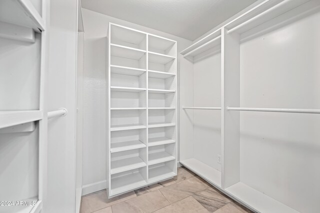 394 E Redfield Rd, Chandler, AZ 85225 - walk in closet with light tile patterned flooring