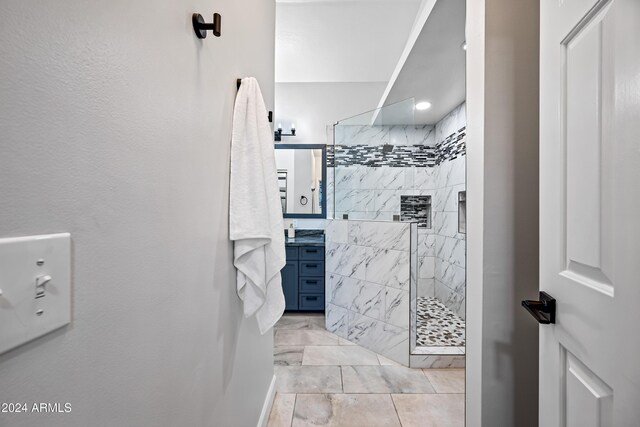 394 E Redfield Rd, Chandler, AZ 85225 - bathroom featuring vanity, a walk in shower, and marble look tiles
