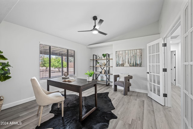 dining room featuring ceiling fan, french doors, hardwood / wood-style floors, and vaulted ceiling