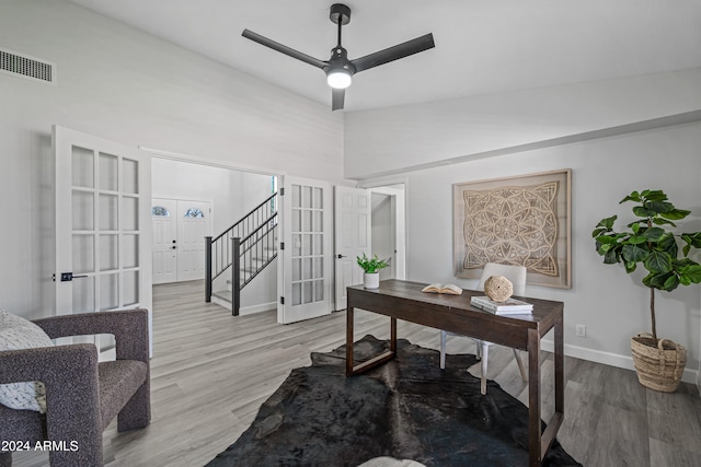 office featuring ceiling fan, french doors, high vaulted ceiling, and light hardwood / wood-style floors