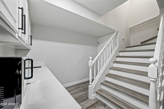 stairs with wood-type flooring