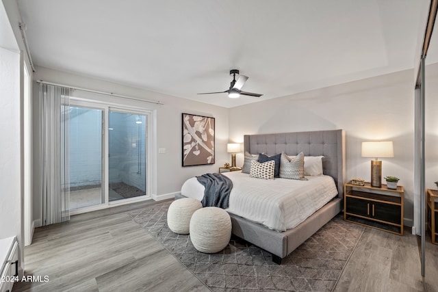 bedroom featuring ceiling fan, access to exterior, and wood-type flooring