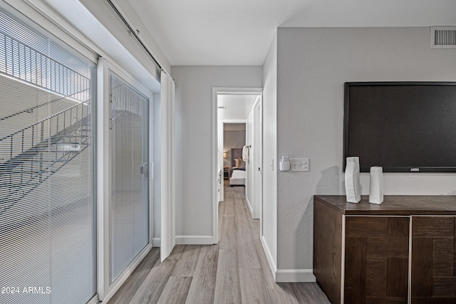 hallway featuring light hardwood / wood-style floors