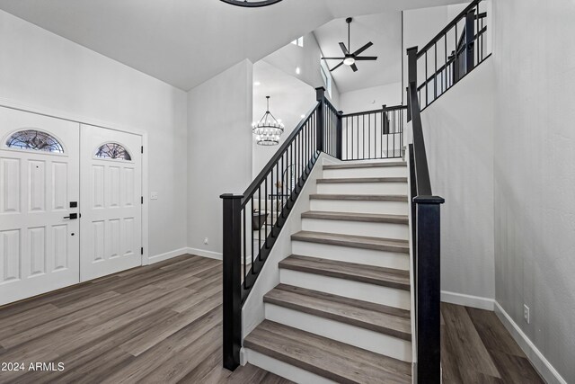394 E Redfield Rd, Chandler, AZ 85225 - entryway featuring ceiling fan, wood finished floors, stairs, baseboards, and a chandelier