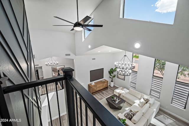 interior space featuring plenty of natural light, high vaulted ceiling, and hardwood / wood-style floors