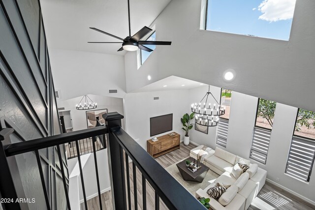 394 E Redfield Rd, Chandler, AZ 85225 - living room with a chandelier, plenty of natural light, a high ceiling, wood finished floors, and recessed lighting