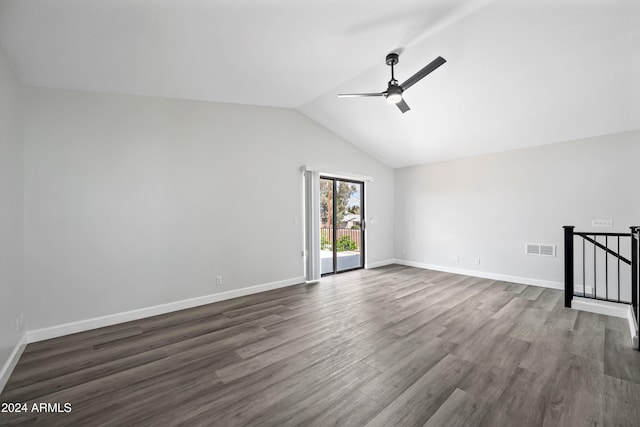 empty room with dark hardwood / wood-style floors, ceiling fan, and lofted ceiling