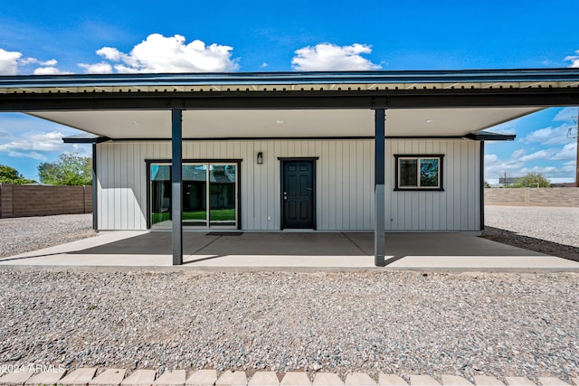 back of property with a patio