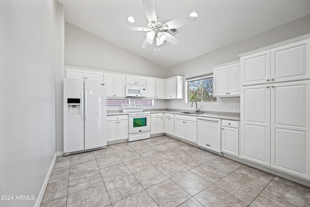 kitchen with lofted ceiling, sink, white cabinets, and white appliances