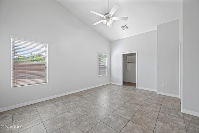 394 E Redfield Rd, Chandler, AZ 85225 - unfurnished room with high vaulted ceiling, plenty of natural light, a ceiling fan, tile patterned floors, and baseboards