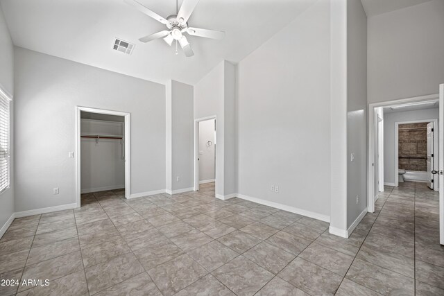 394 E Redfield Rd, Chandler, AZ 85225 - unfurnished bedroom featuring high vaulted ceiling, baseboards, a closet, and a ceiling fan