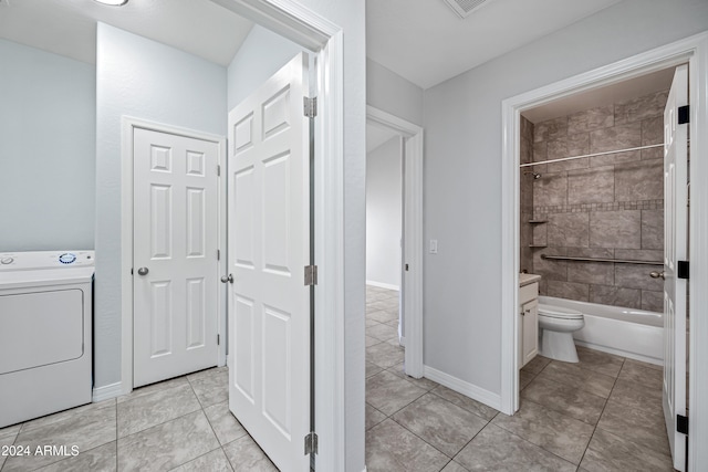 interior space with washer / dryer and light tile patterned floors