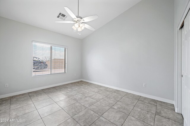 394 E Redfield Rd, Chandler, AZ 85225 - empty room with vaulted ceiling, light tile patterned floors, a ceiling fan, and baseboards