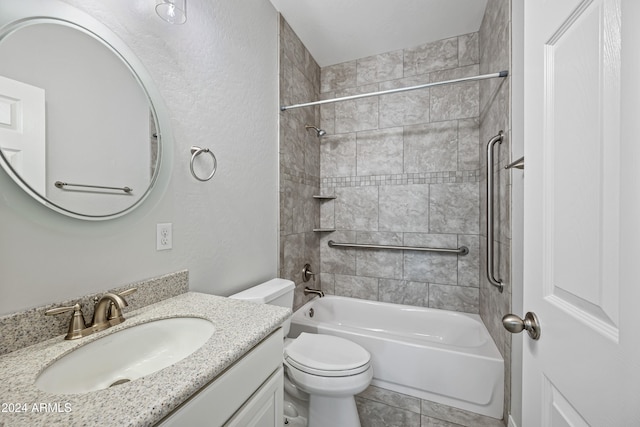 full bathroom with tile patterned flooring, vanity, toilet, and tiled shower / bath