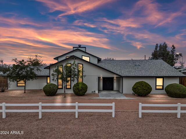 394 E Redfield Rd, Chandler, AZ 85225 - view of front facade featuring roof with shingles, a fenced front yard, and a chimney