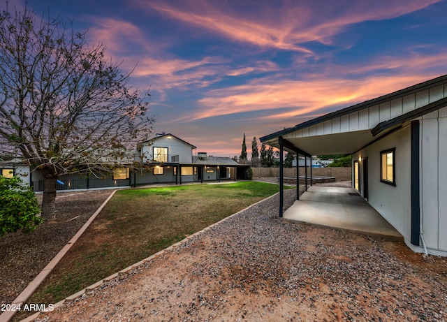 yard at dusk with a patio