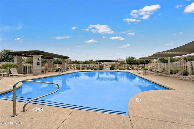 view of swimming pool with a patio and a pergola