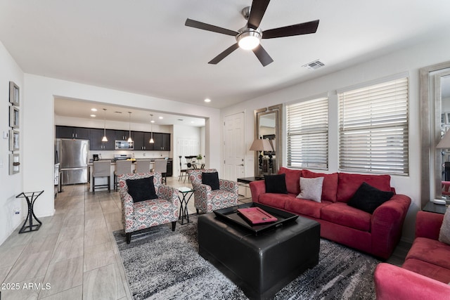 living room with ceiling fan